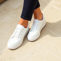 White minimalist low-top leather sneakers