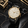 Brushed steel automatic field watch on leather strap